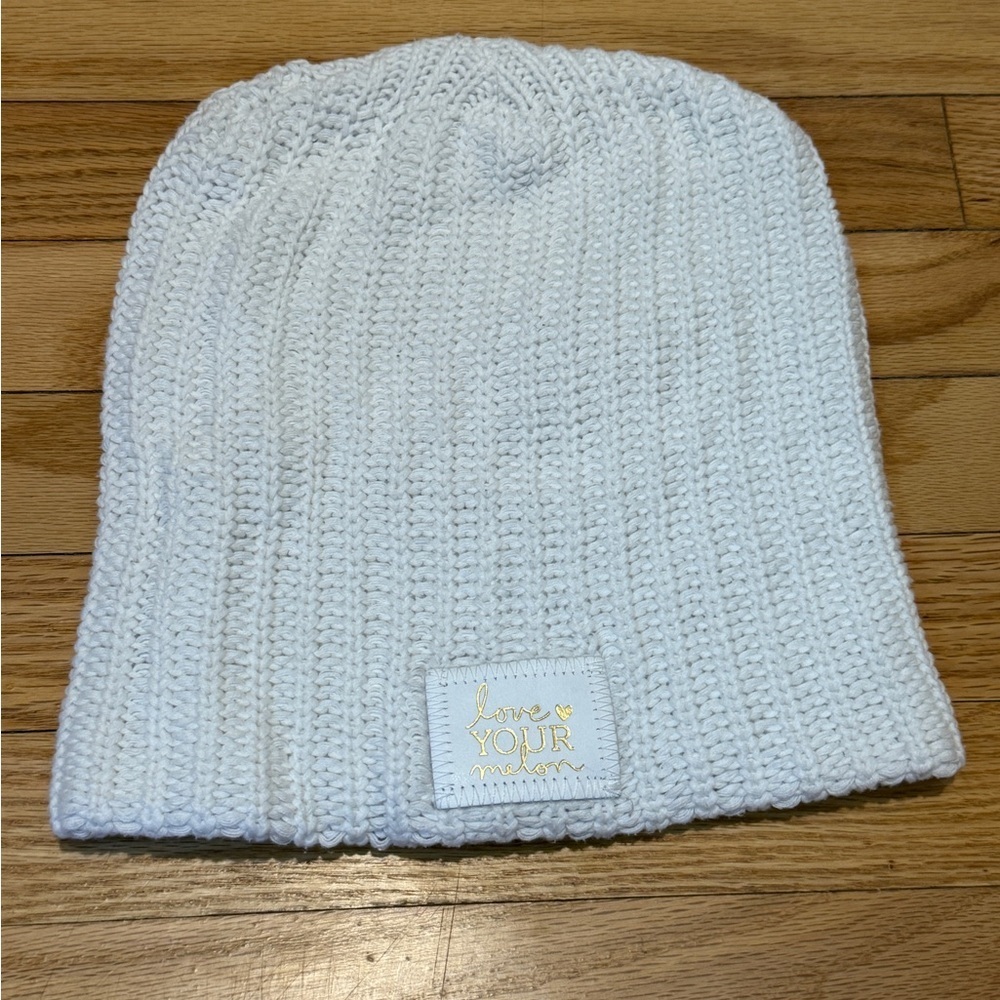 Love Your Melon White Beanie with white monochrome and Gold Writing.